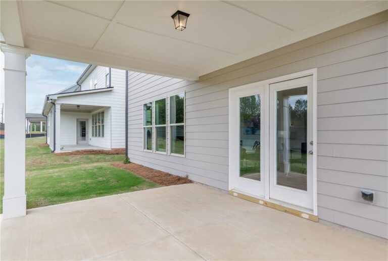 Covered rear porch of a Parkview Landing model home in Buford, GA